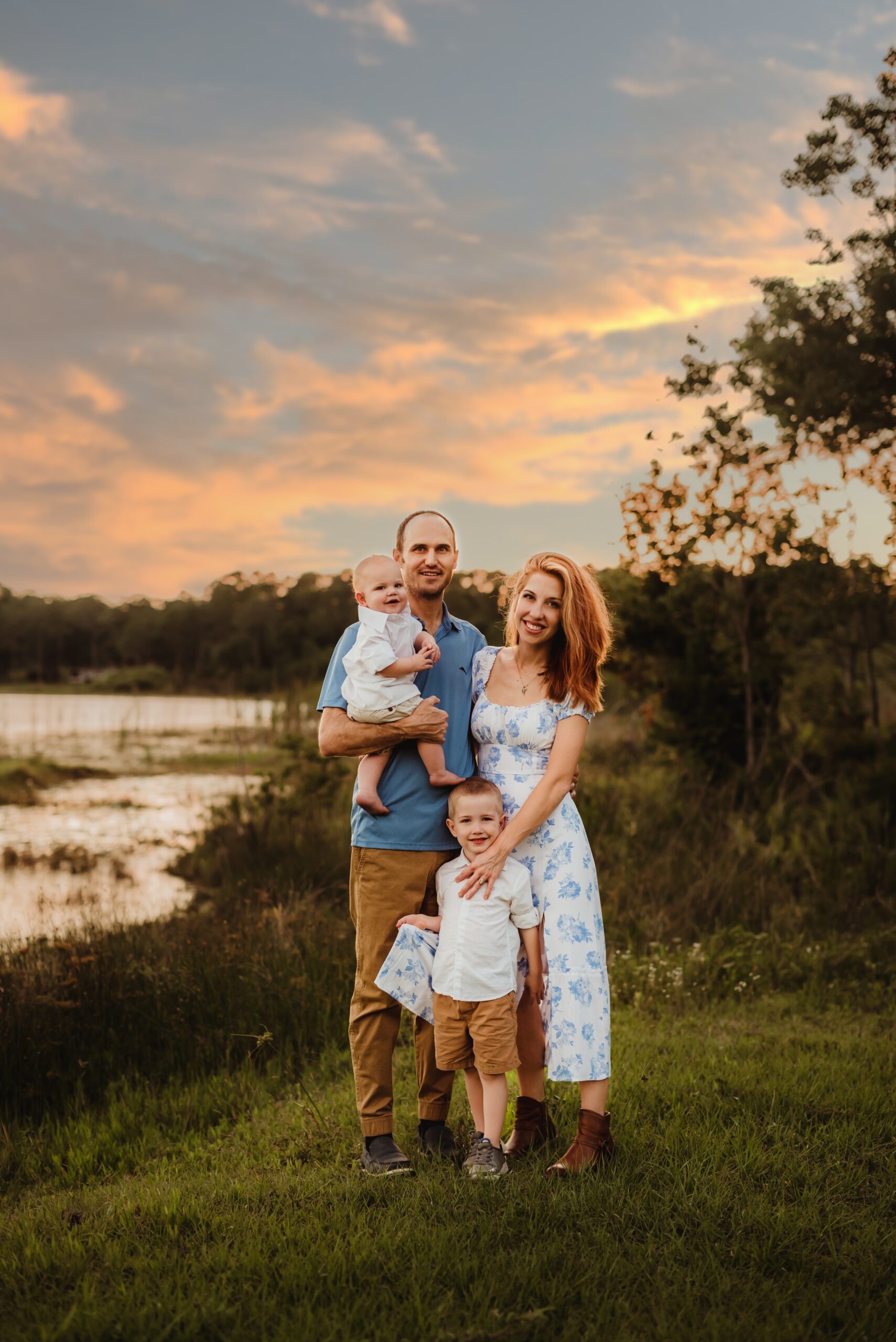 family at sunset by the lake