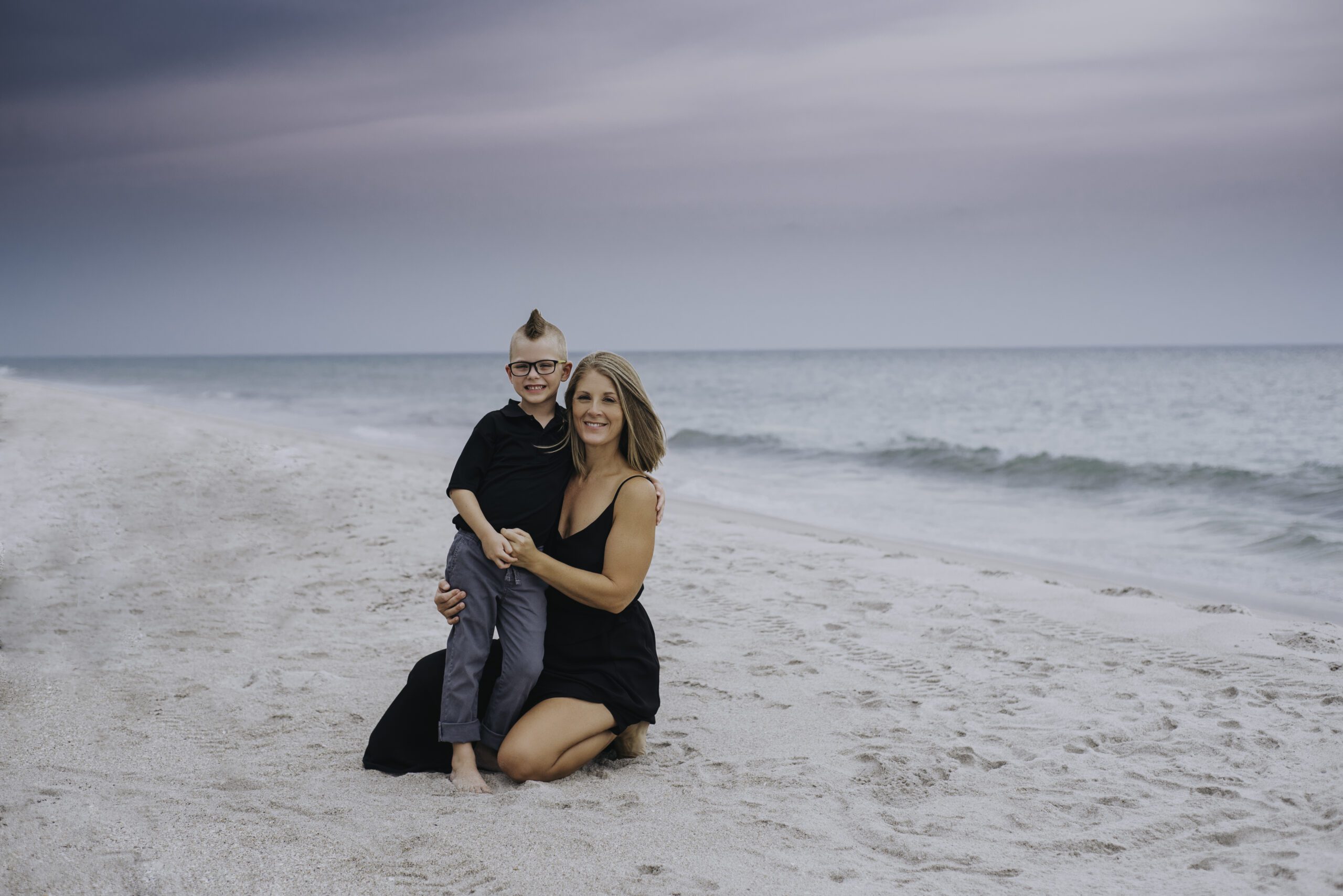 mother and son with mohawk at the beach