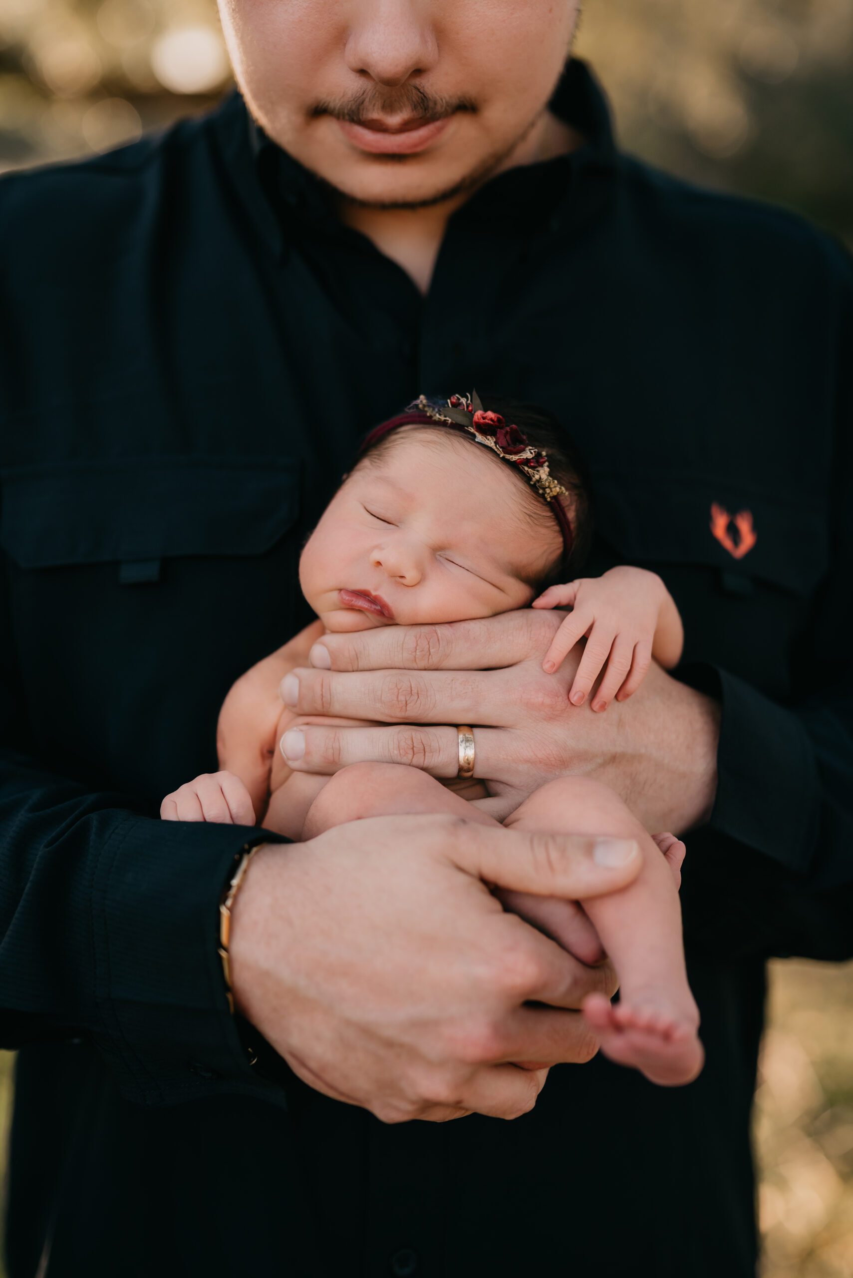 dad holding newborn baby